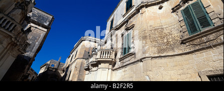 The sandstone facades of Santi Patroni church at the entrance to the Piazza del Duomo Lecce Puglia Italy Stock Photo