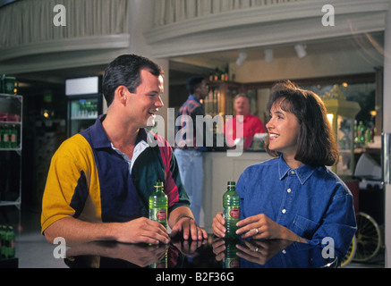 A young tourist couple enjoy a cool drink in a local Hot Springs, Arkansas bistro Stock Photo