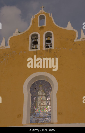 Bell tower cross and Virgin Mary stained glass window on from Convent of San Antonio de Padua Izamal Yucatan Mexico Stock Photo