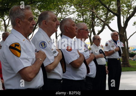 Korean War veterans and their families gather at the Universal Soldier Korean War Monument in Battery Park in New York Stock Photo