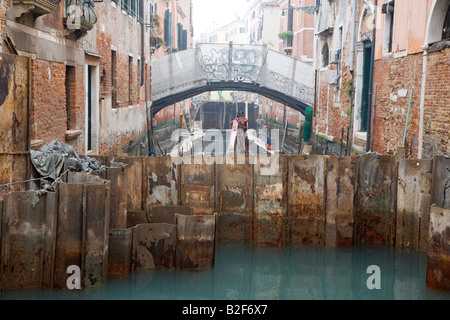 Canal repair works to drained canals Venice Italy Stock Photo