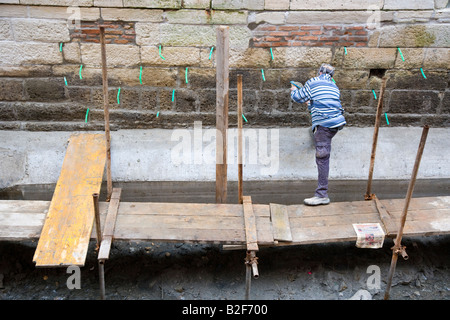 Canal repair works to drained canals Venice Italy Stock Photo