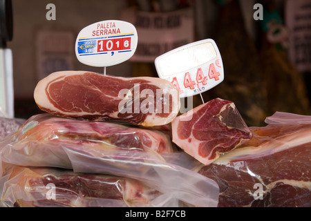 SPAIN Salamanca Jamon displayed in market with price in euros on sign cured ham is a Spanish delicacy Stock Photo