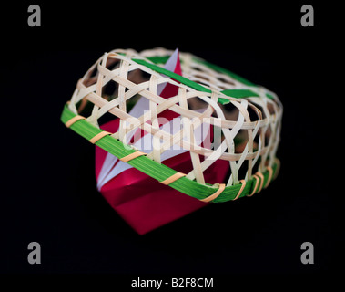 Origami rabbit caught in a basket. Stock Photo