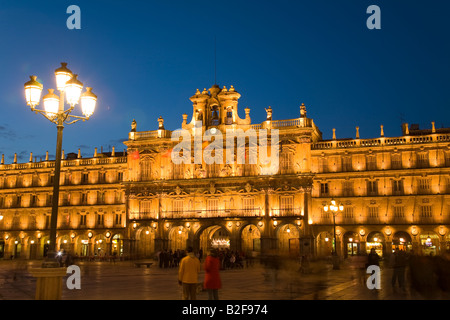 SPAIN Salamanca Plaza Mayor at night crowds gather in square built in 1700s Town Hall building details lit Stock Photo
