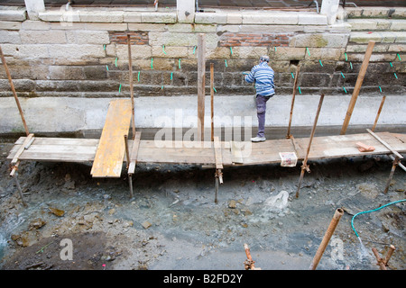 Canal repair works to drained canals Venice Italy Stock Photo