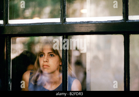 tourist looking through window of the Anne Frank House amsterdam Stock Photo