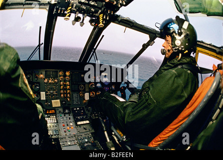 pilot in the cockpit of an air sea rescue helicopter Stock Photo