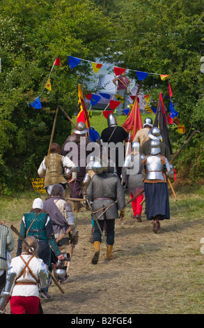 Soldiers in armour march from battle at Tewkesbury Medieval Festival Worcestershire UK EU Stock Photo