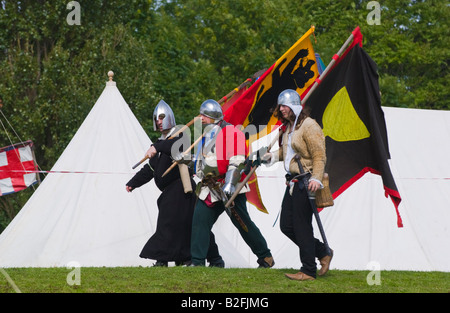 Standard bearers march to battle at Tewkesbury Medieval Festival Worcestershire UK EU Stock Photo