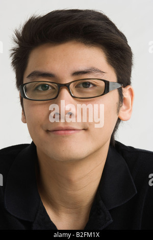 Portrait of a young man smirking Stock Photo