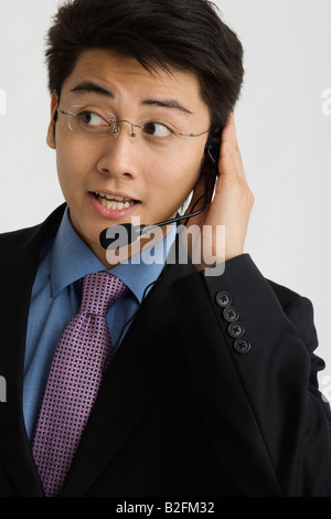 Close-up of a businessman wearing a headset Stock Photo