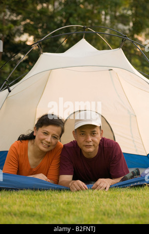 Portrait of a mature couple resting in the tent Stock Photo