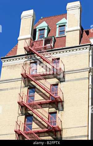 new york city building fire escape ladders Stock Photo - Alamy