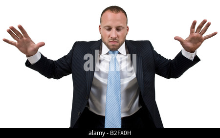 business man holding his hands up in anger and frustration Stock Photo