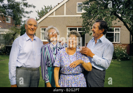 four elderly people pose in a london garden Stock Photo