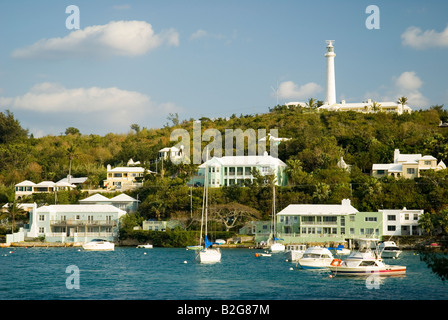 Boats anchored in Jew s Bay Southampton Bermuda with Gibbs Hill Lighthouse in the background. Stock Photo