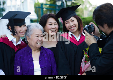 Mid adult man photographing of his family Stock Photo