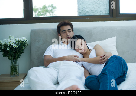 Couple sleeping on the bed Stock Photo