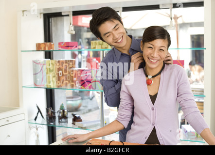 View of a cheerful young couple in a jewelry store Stock Photo