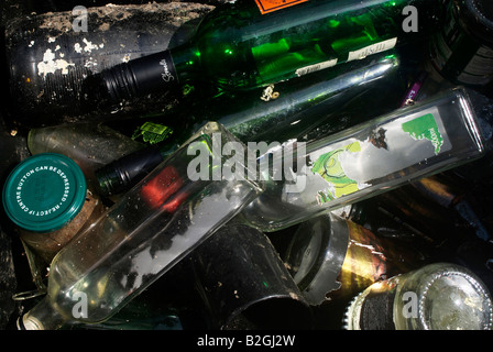 Glass bottles laying in a bin discarded and ready for recycling. Stock Photo