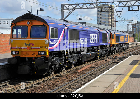 Diesel freight locomotive 66729 in first GBRf livery running light behind 66717 seen at Stratford East London Stock Photo