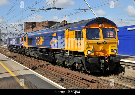 Diesel freight locomotive 66717 named Good Old Boy in first GBRf livery running light with 66729 seen at Stratford East London Stock Photo