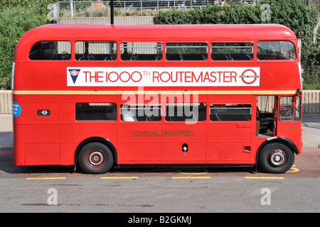 Part of London Transport historical heritage a classic red Double decker London AEC Routemaster with poster commemorating the 1000th bus England UK Stock Photo