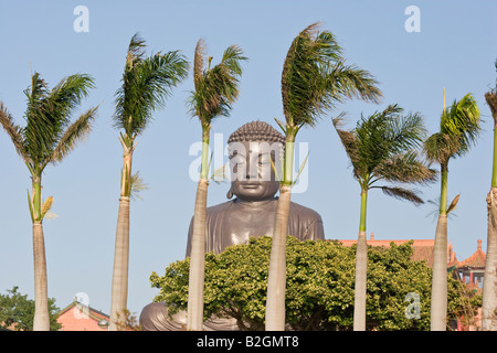 Big Great 22m high Buddha of Baguashan and palm trees on a windy day Baguashan Changhua Taiwan ROC Republic of China Stock Photo