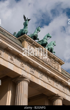 Sculpture showing Quadriga driven by a female figure known as peace designed by Johann Gottfried Schadow atop Brandenburg Gate in Berlin Germany Stock Photo