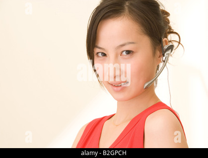 Close-up of a young woman wearing a headset Stock Photo