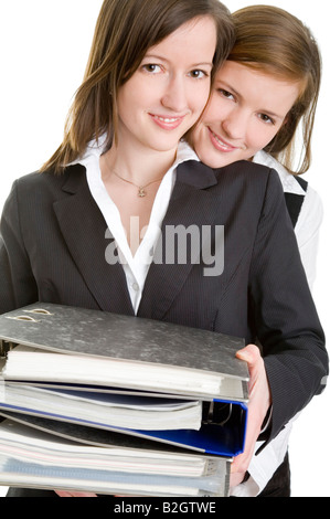 couple office assistants office document file business women managers young businesswomen tradeswomen secretary clerks pair Stock Photo