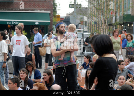 Audience at a free concert in Gansevoort Plaza in the trendy Meatpacking District in New York Stock Photo