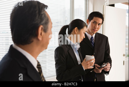 Three business executives in an office Stock Photo