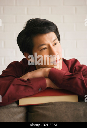 Close-up of a young man thinking Stock Photo