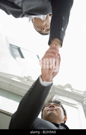 Low angle view of two businessmen shaking their hands Stock Photo
