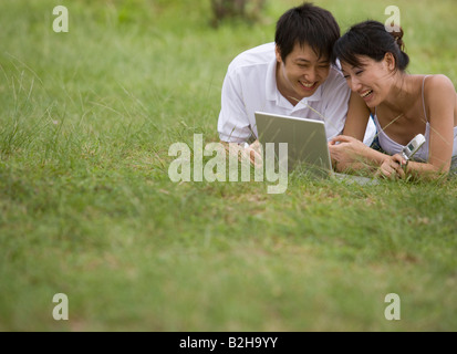 Young couple using a laptop Stock Photo