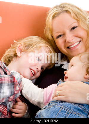 mother sons sib siblings familly portrait consonance harmoniousness harmony Stock Photo