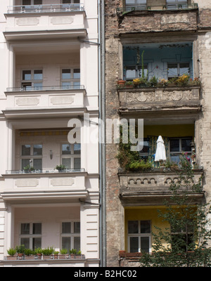 Contrasting old and renovated facades of apartment tenement buildings in Prenzlauer Berg in Berlin 2008