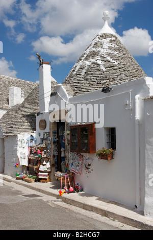 Hex signs painted on the top of a Trulli house  used as a shop, in Alberobello,Puglia, Italy Stock Photo