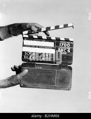 movie, clapperboard, 20th century, hand, hands, holding, hold, historic, historical, clapperboard, clapboard, production slate, production board, clapperboards, clapboards, production slates, production boards, man, men, male, people, Stock Photo
