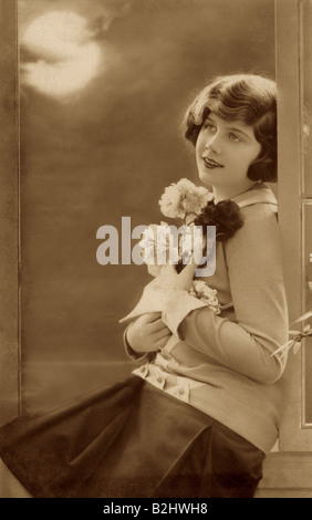 people, women, young woman, half length, sitting in open window, circa 1920, Stock Photo