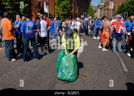 Collecting litter as glasgow rangers fans gather in manchester for the euro final 2008. Stock Photo