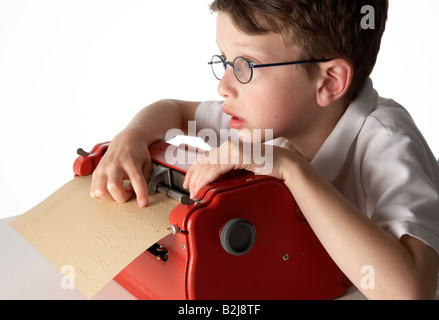 A visually impaired blind school boy using a braille machine brailler Stock Photo