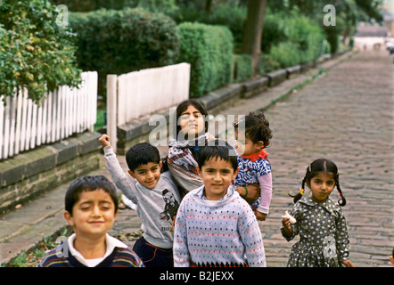 asian children playing on the street in bradford Stock Photo