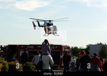 Flight for Life helicopter flying away from a Fire Safety Fair Stock Photo