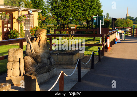 LECHLADE, GLOUCESTERSHIRE, UK - JULY 04, 2008:  Statue of Old Father Thames beside the River Thames at St John's Lock near Lechlade Stock Photo