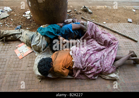 Homeless Boys Sleeping in the Streets of Mumbai India Stock Photo