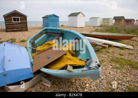 Beach huts and boats on the beach at Kingsdown near Deal in Kent Stock Photo