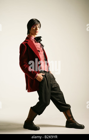 Young stylish man posing, studio shot. Stock Photo